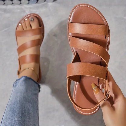 KS | Flat sandals with open back and buckle decoration