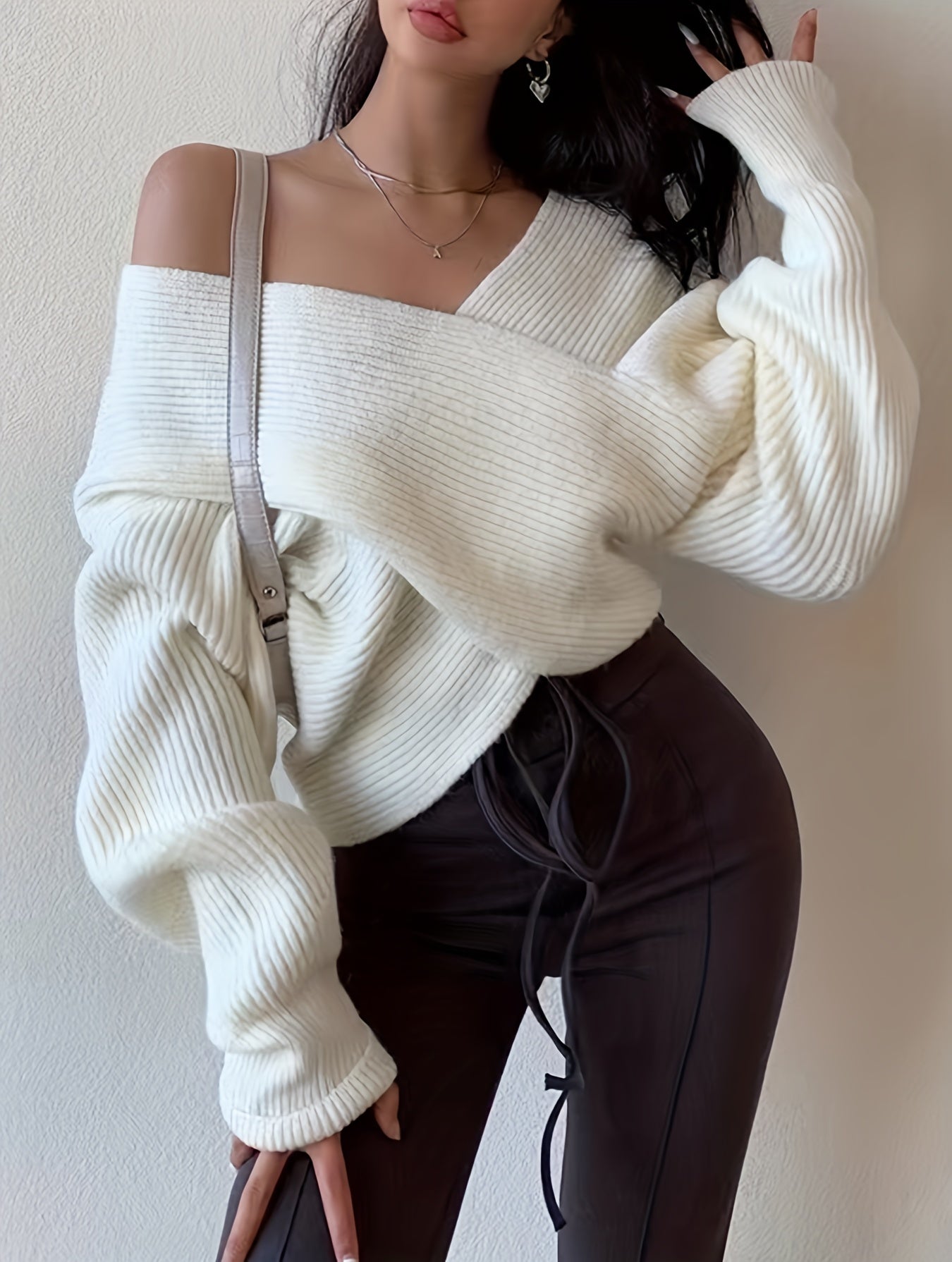 Elda® | Solid knit sweater with a wrap front